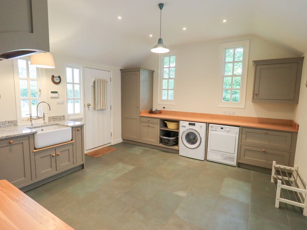 A kitchen with a sink and appliances at Little Ellers in Portinscale near Keswick