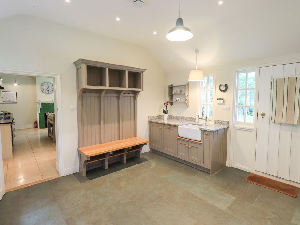 A kitchen with a sink and a bench at Little Ellers in Portinscale near Keswick