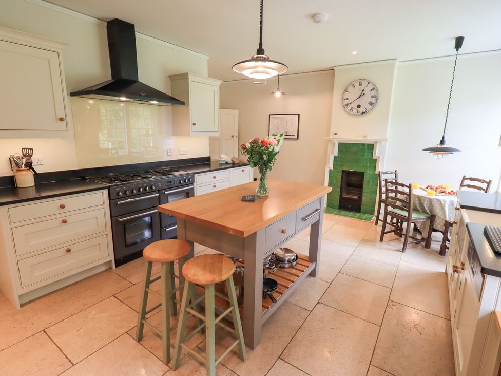 A kitchen with an island and oven at Little Ellers in Portinscale near Keswick