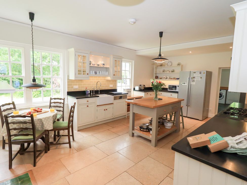 A kitchen with a table and chairs at Little Ellers in Portinscale near Keswick