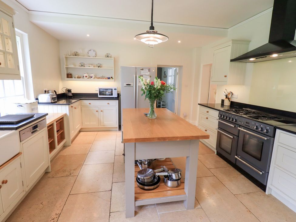 A kitchen with an island and appliances at Little Ellers in Portinscale near Keswick