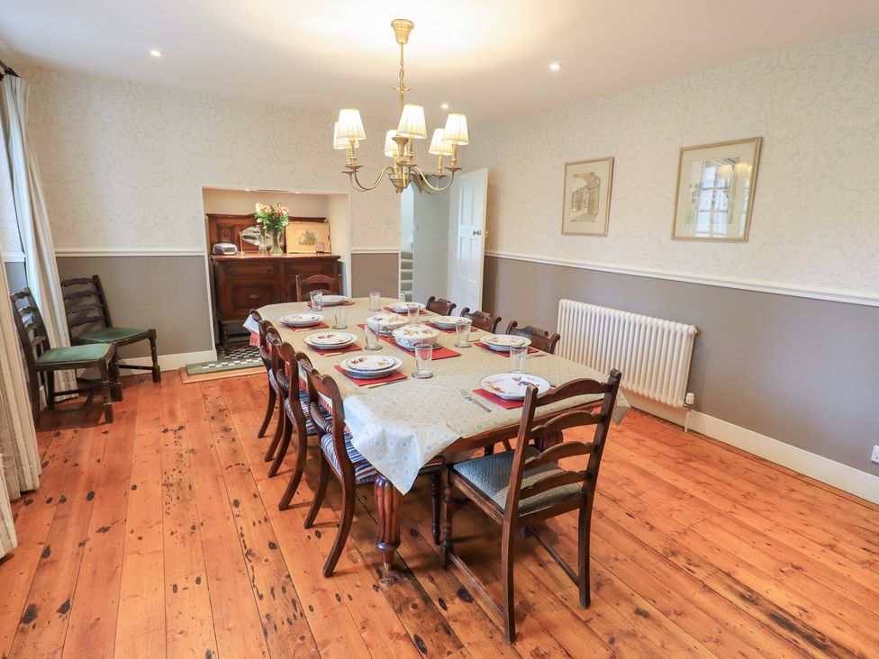 A dining room with a table set for dinner at Little Ellers Portinscale near Keswick