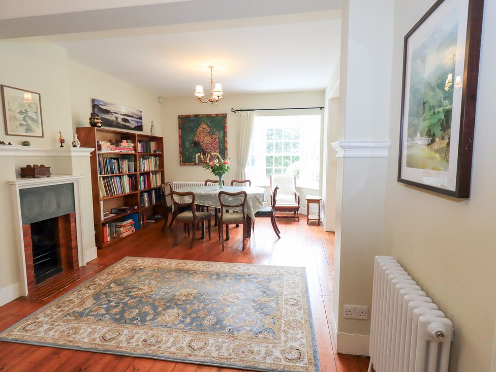 A dining room with a table and chairs at Little Ellers Portinscale near Keswick