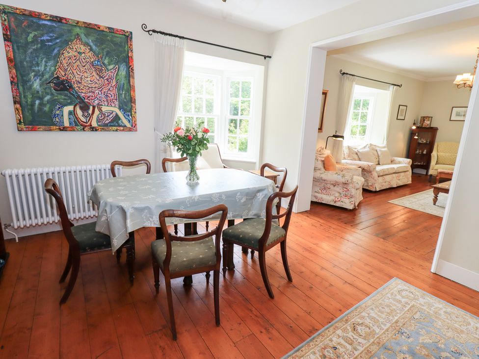A dining room with a table and chairs at Little Ellers in Portinscale near Keswick