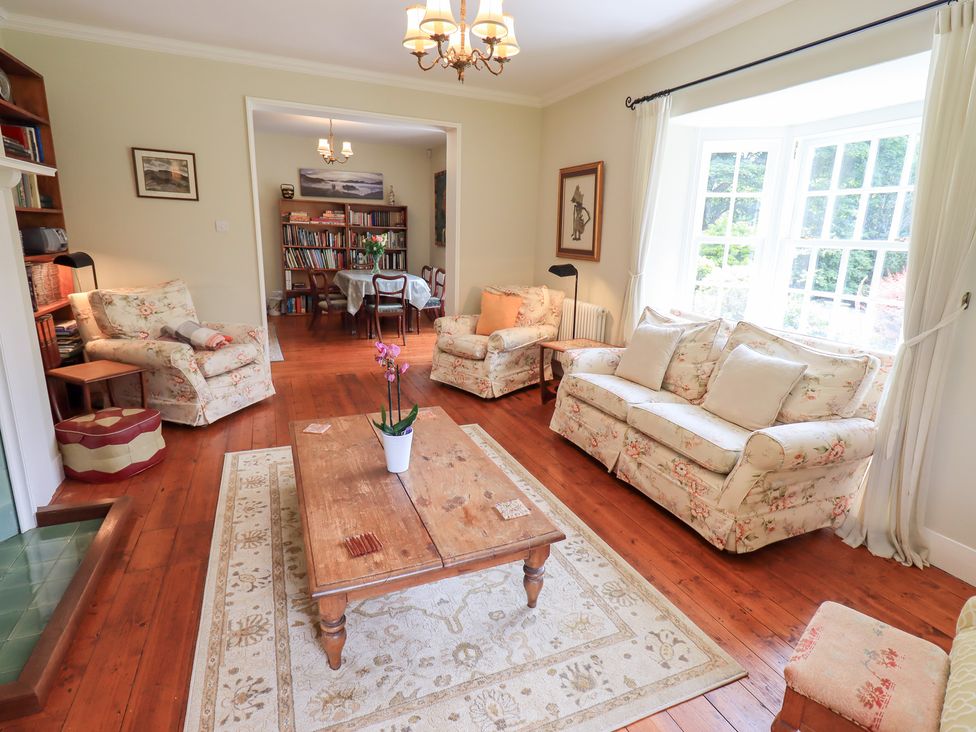 A living room with a sofa and armchairs at Little Ellers in Portinscale near Keswick