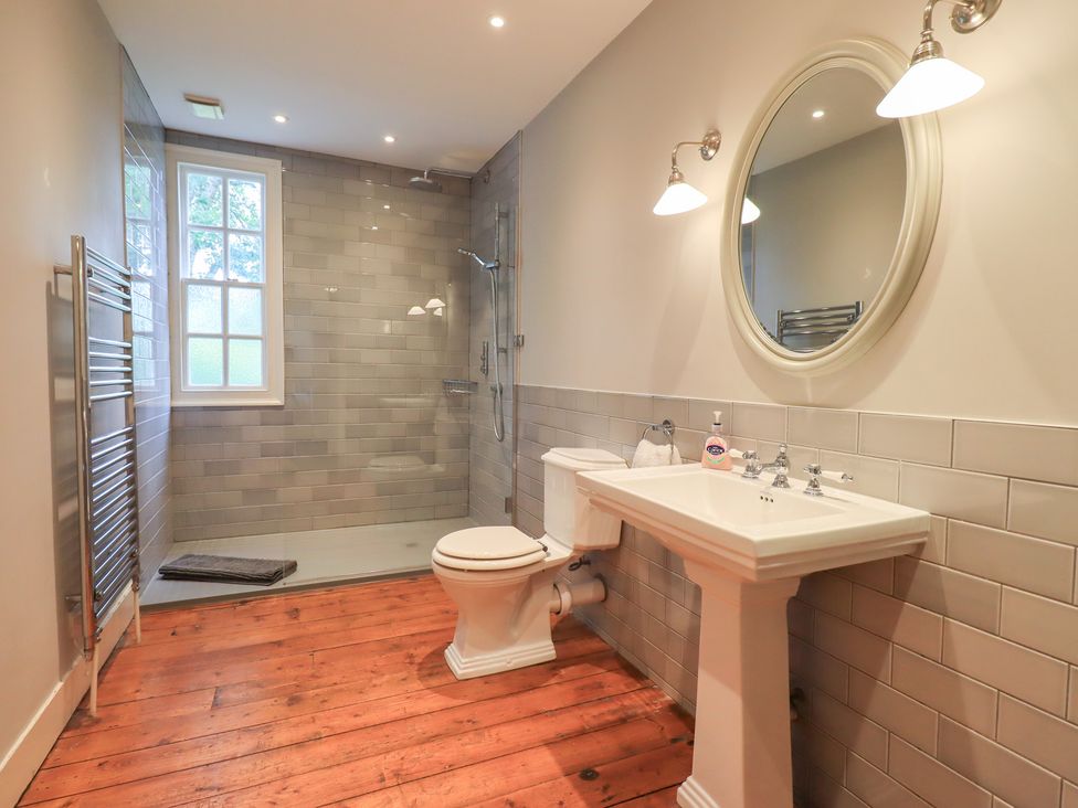 A bathroom with a shower and sink at Little Ellers Portinscale near Keswick