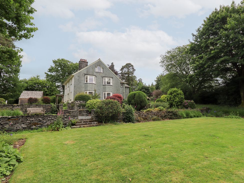 A house with a garden and trees at Little Ellers in Portinscale near Keswick