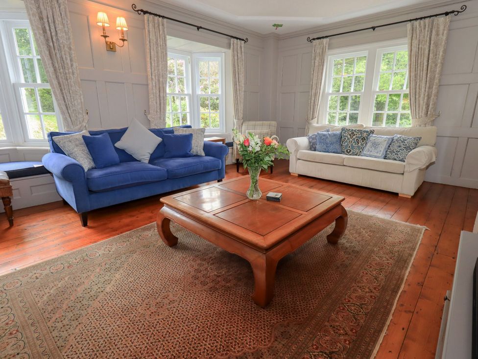 A living room with sofas and a coffee table at Little Ellers in Portinscale near Keswick