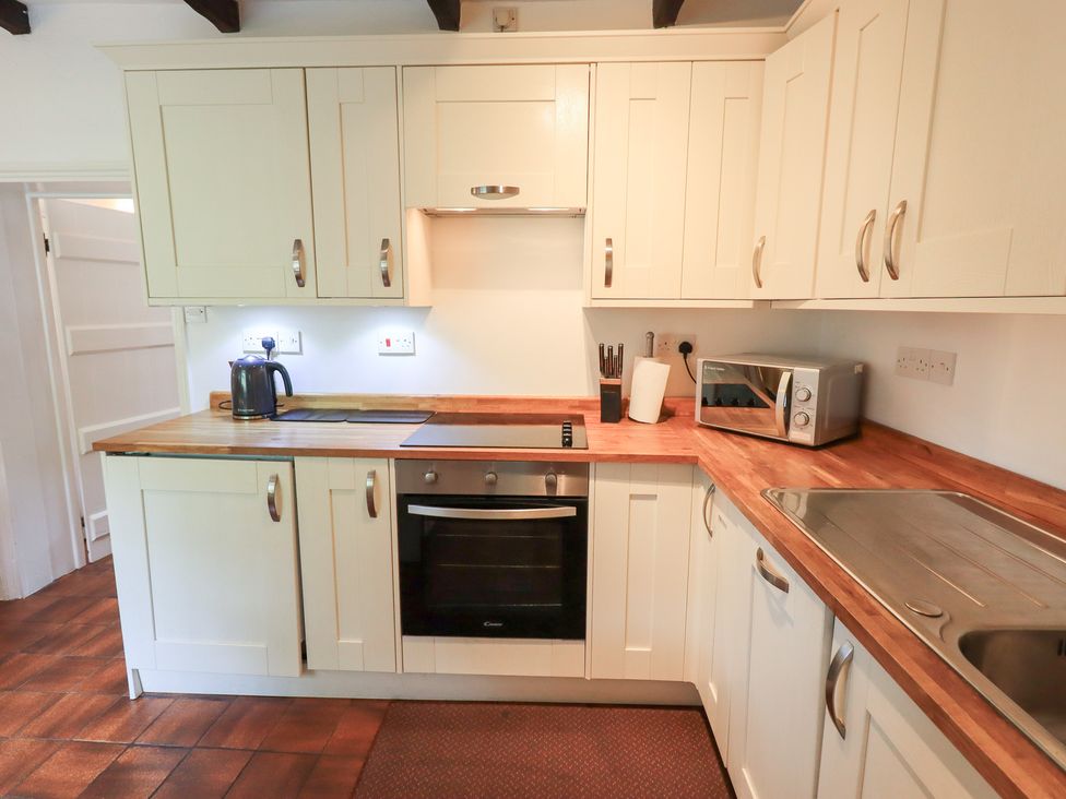A kitchen with appliances and cabinets at Millcroft in Glenridding