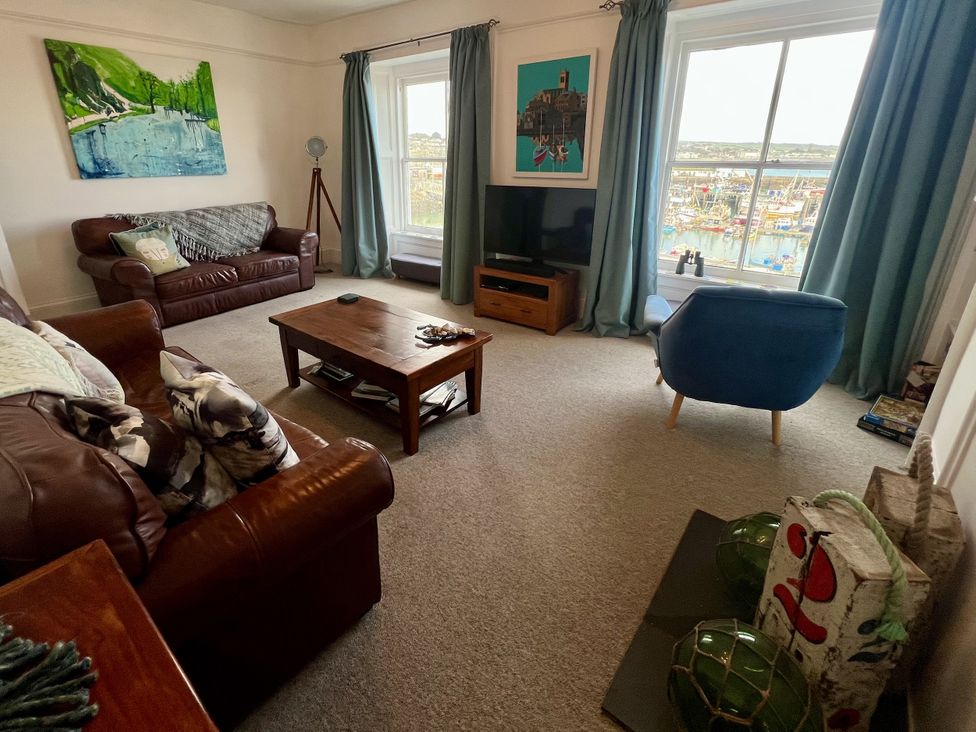 A living room with a coffee table and sofa at Westcliff in Newlyn