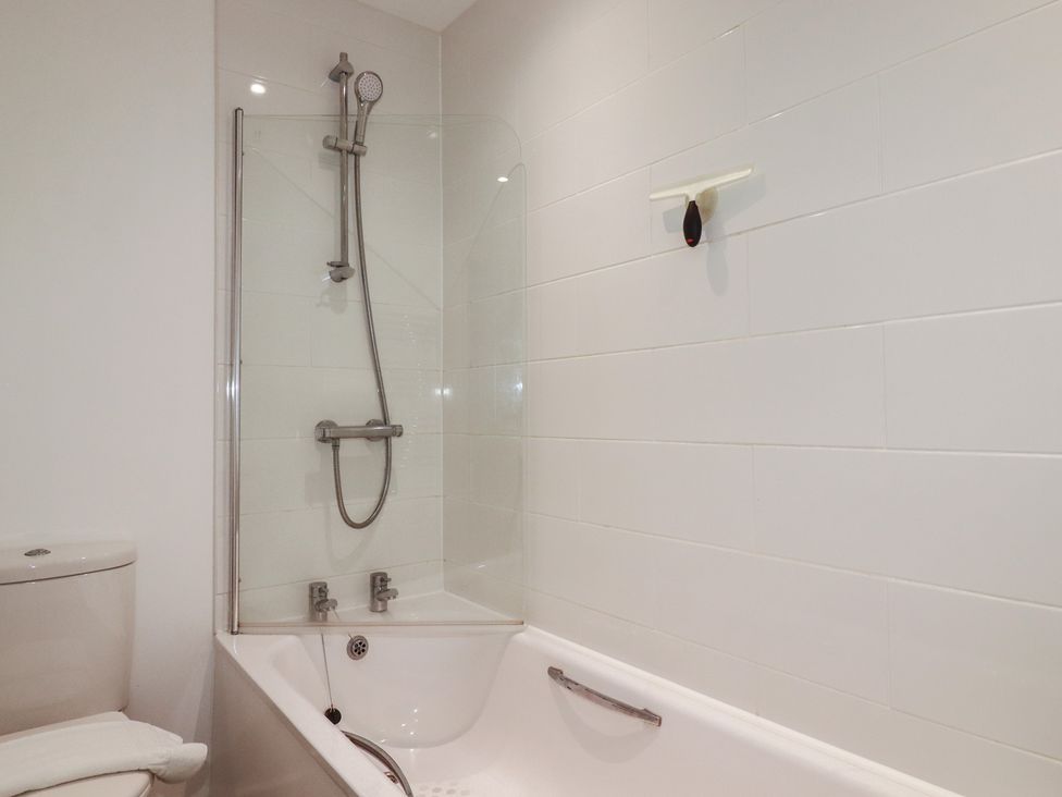 A bathroom with a bathtub and shower at The View in Newquay