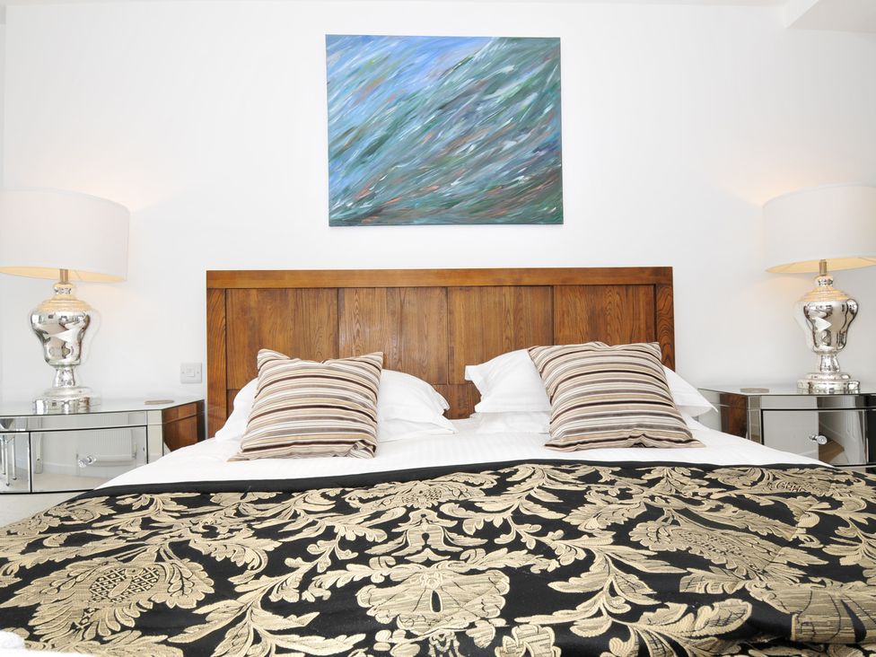 A bedroom with a bed and lamp at The View in Newquay
