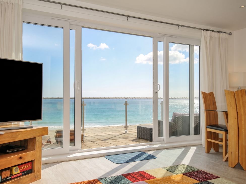 A living room with a view of the ocean at The View in Newquay