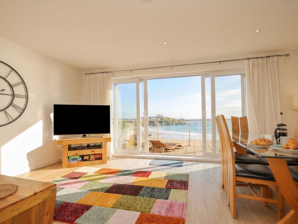 A living room with a television and a view at The View in Newquay