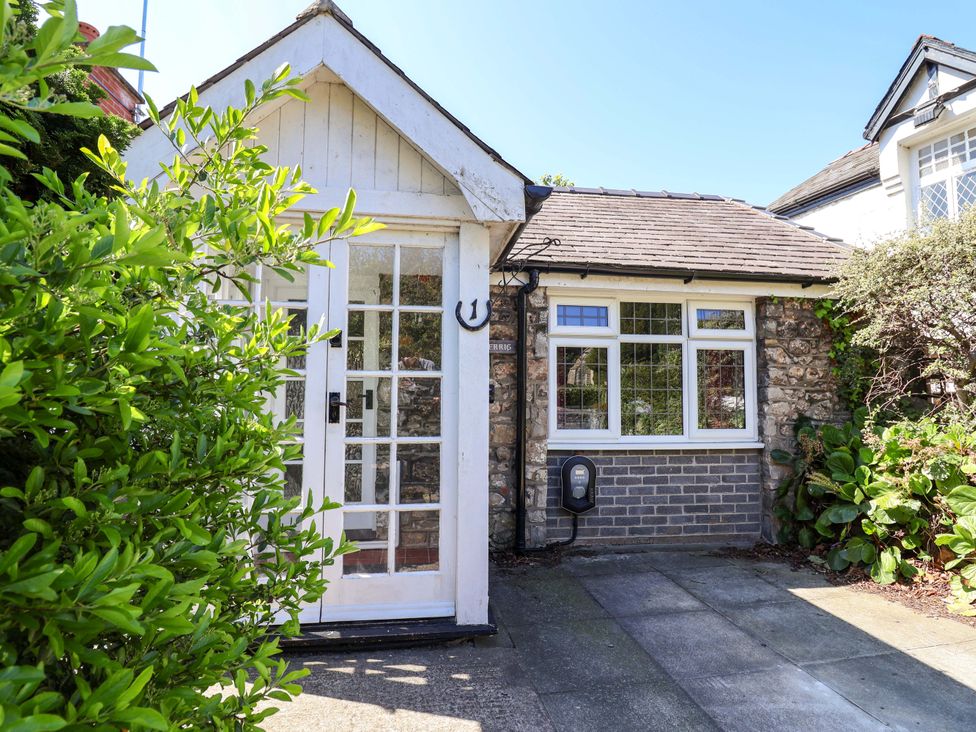 A front entrance with a door and window at Ty Cerrig Dyserth