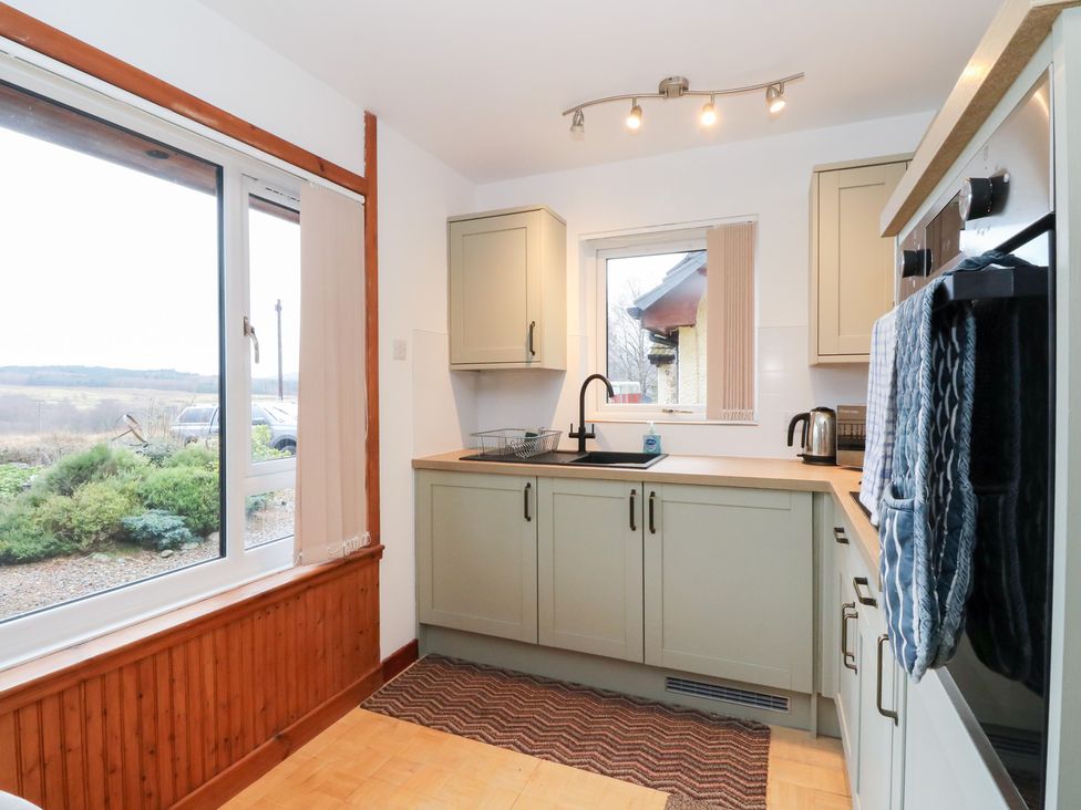 A kitchen with a sink and kettle at Alba Ben View in Spean Bridge