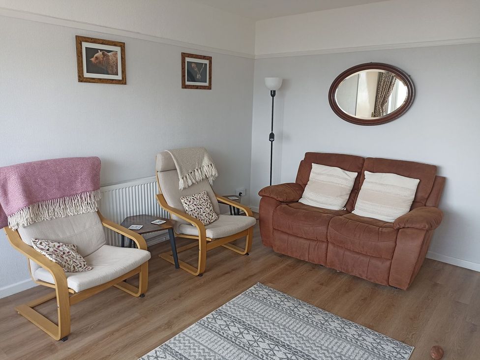 A living room with two armchairs and a brown sofa at Dubrovnik