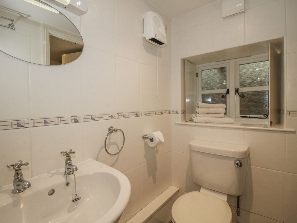 A bathroom with sink and toilet at Wash House Cottage Much Wenlock