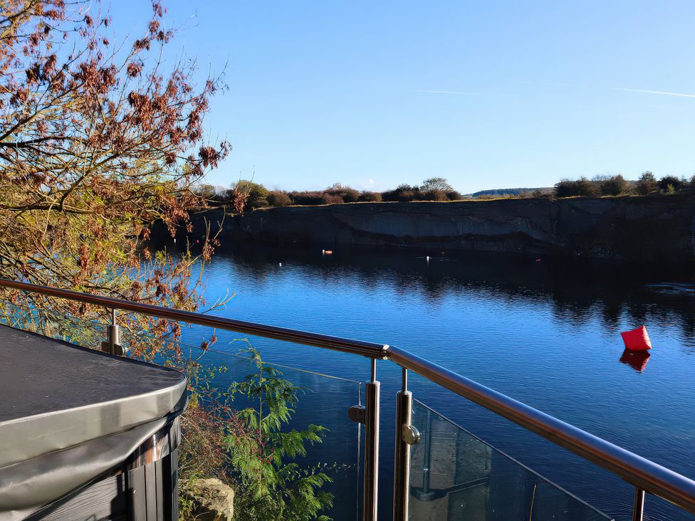 A view of water and trees from a balcony at Boavista in Carnforth