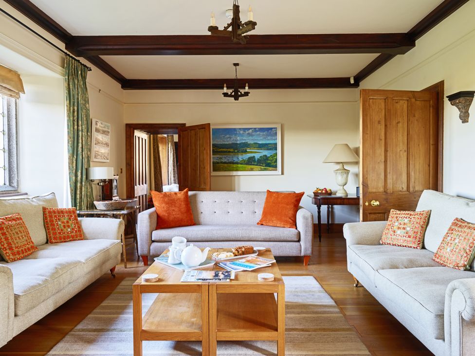 A living room with sofas and a coffee table at Great Bidlake Manor, Bridestowe, near Lydford