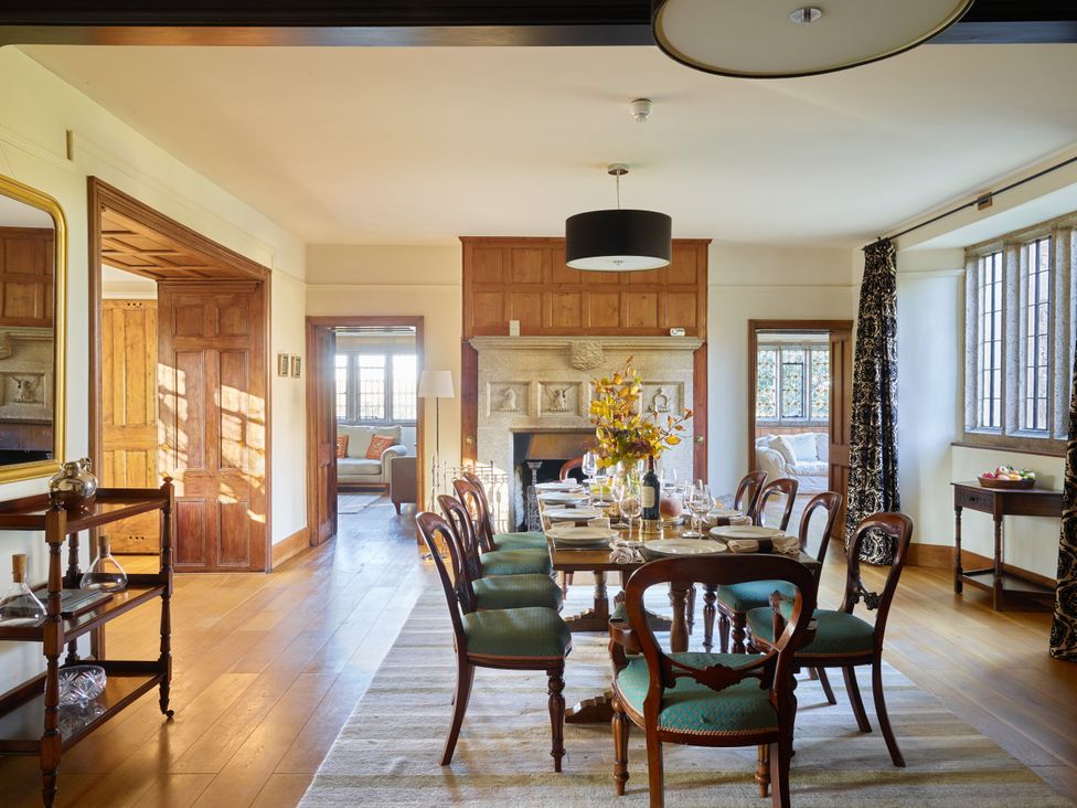 A dining room with a table set for dinner at Great Bidlake Manor, Bridestowe, near Lydford