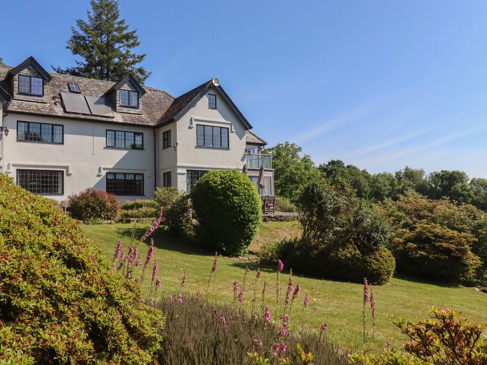 A house with a balcony and garden at Sandsgate near Spinster's Rock, near Chagford