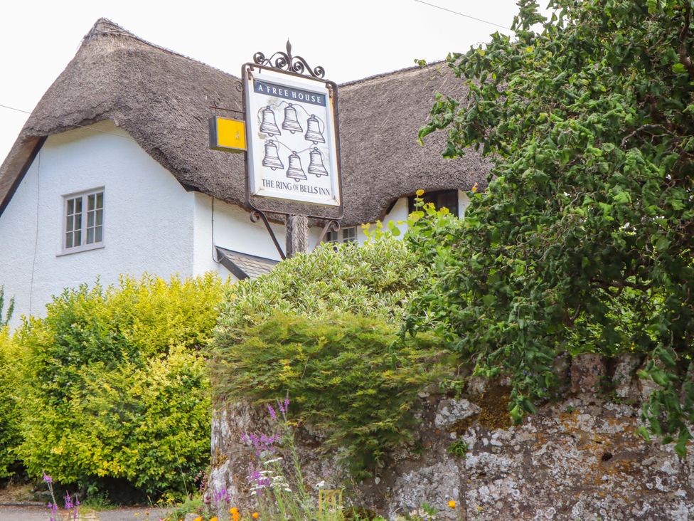 A pub sign for The Ring of Bells Inn with thatched roof at Little Gate Cottage in North Bovey