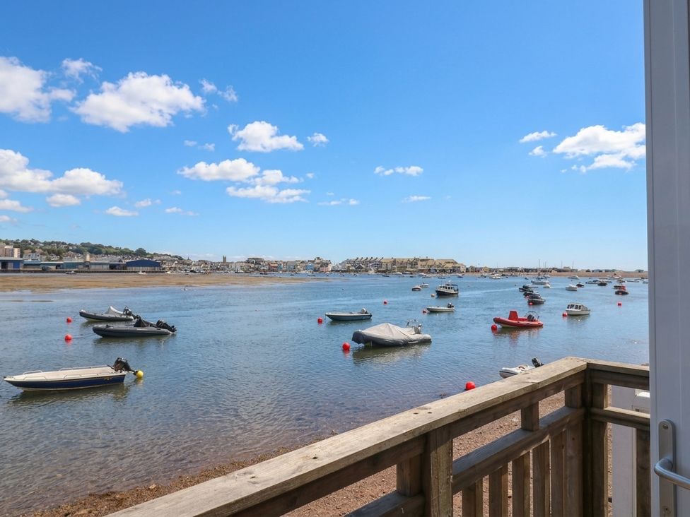 A view of boats on water with a shoreline at The Dolphins in Shaldon