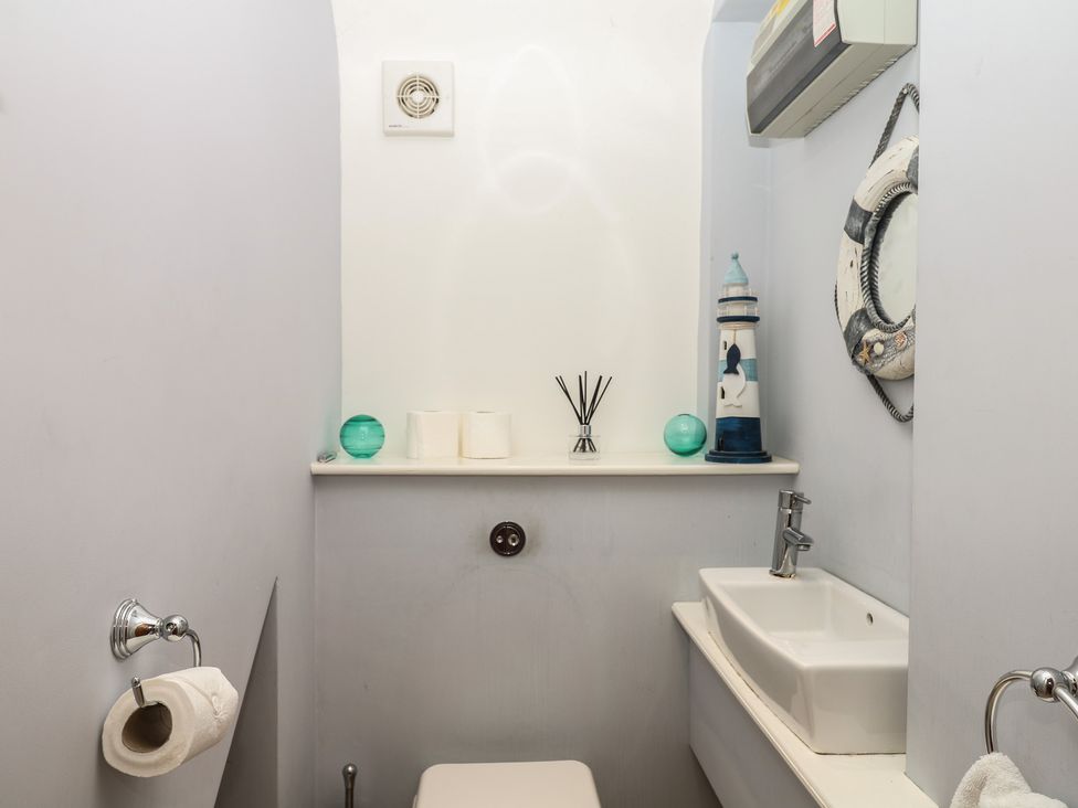 A bathroom with a sink and toilet at The Dolphins in Shaldon
