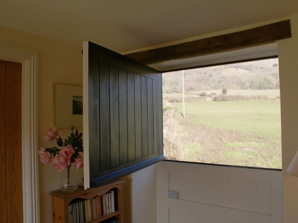 An open door with a view of fields at The Barn in Compton Bishop, near Cheddar