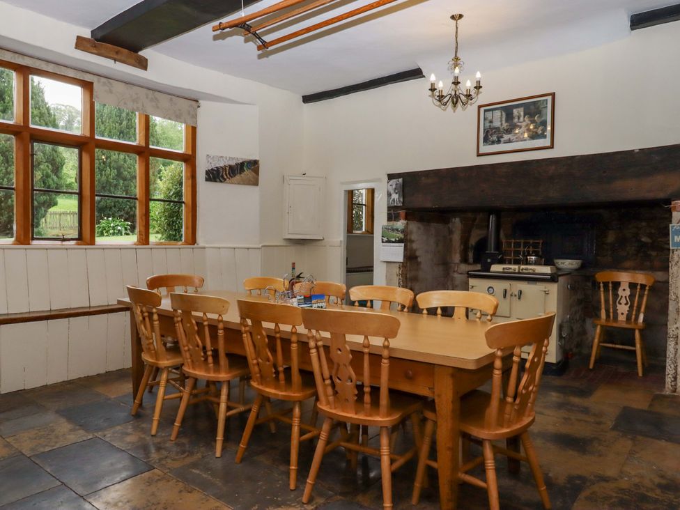 A dining room with a table and chairs at Hornshayne Farmhouse, Farway, near Honiton