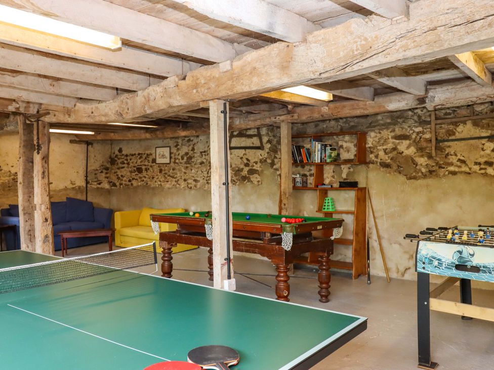 A game room with a ping pong table and a pool table at Hornshayne Farmhouse, Farway, near Honiton