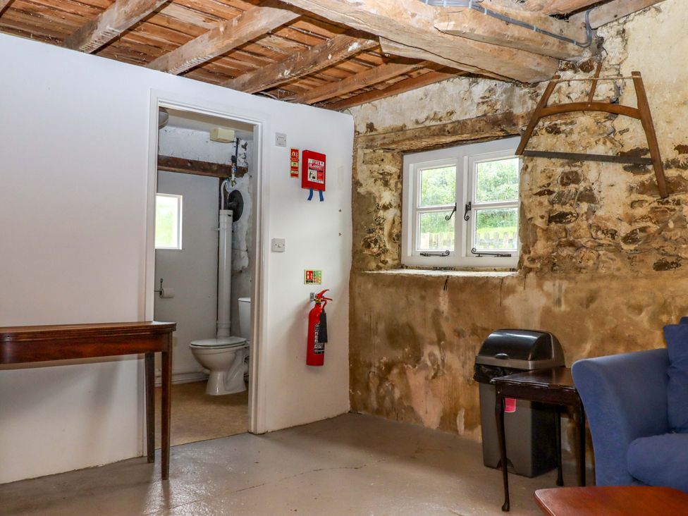 A bathroom with toilet and sink at Hornshayne Farmhouse Farway, near Honiton