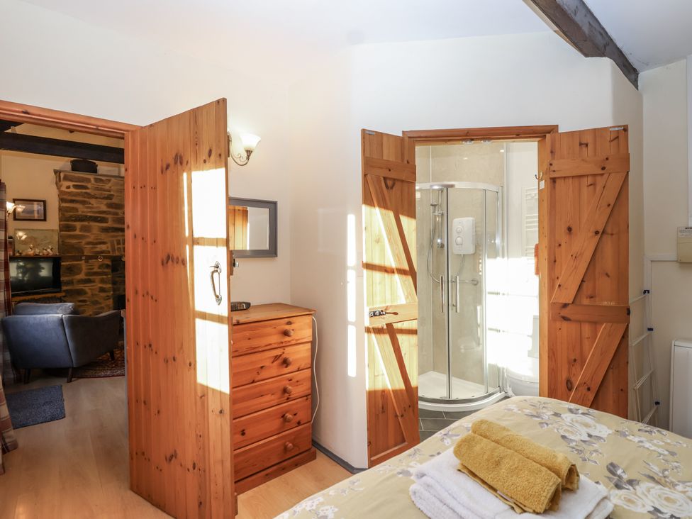 A bathroom with a shower and a drawer at Miners Dry in Gulworthy, near Tavistock