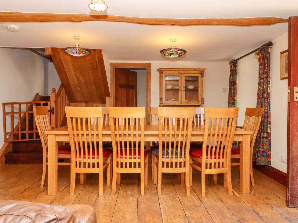 A dining room with a table and chairs at East Bickleigh in Halwell