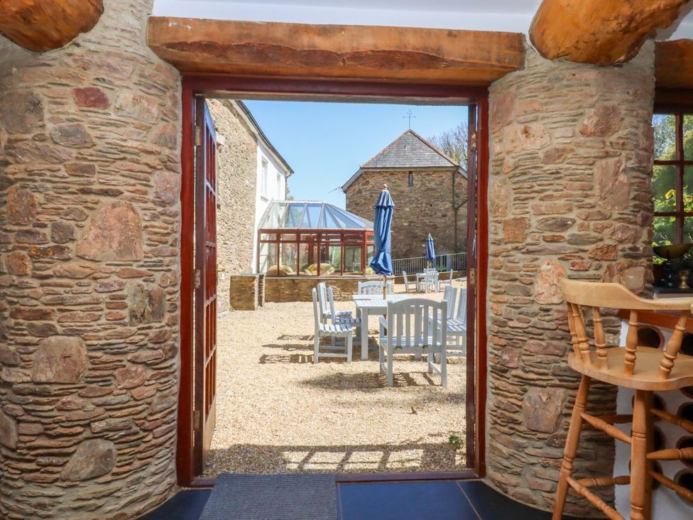 An outdoor view through a doorway at East Bickleigh in Halwell