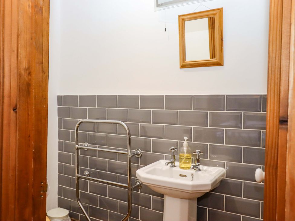 A bathroom with a sink and mirror at East Bickleigh in Halwell