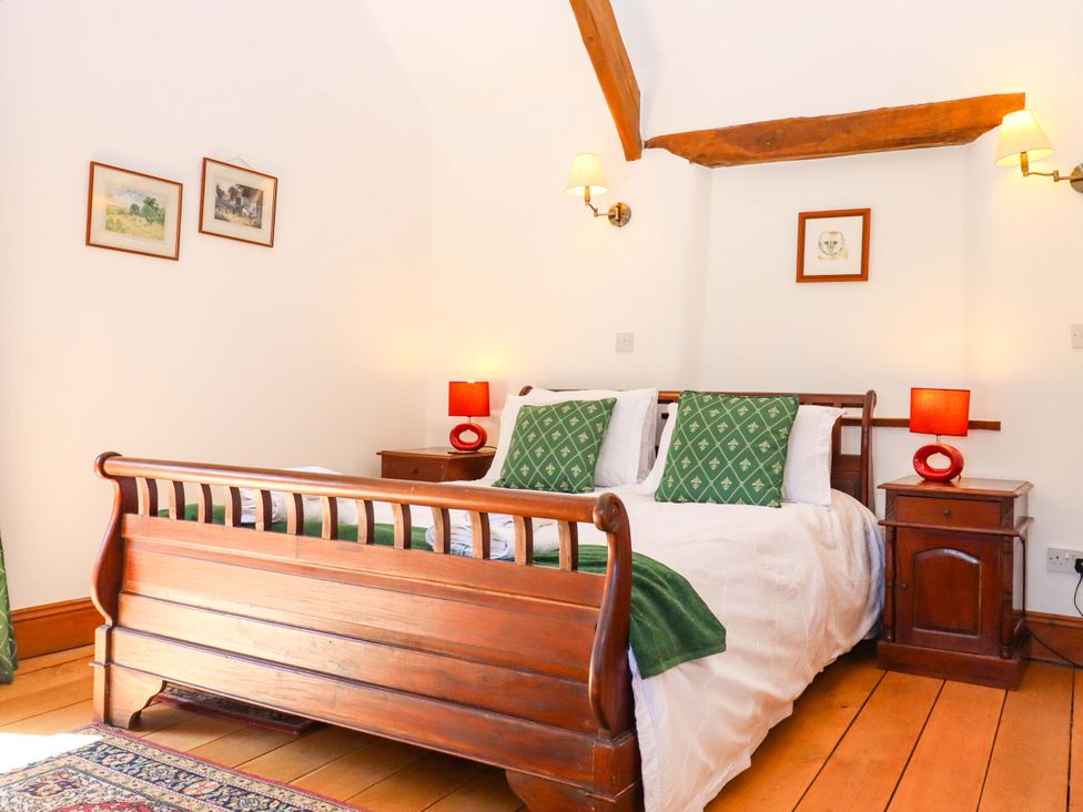 A bedroom with a bed and bedside tables at East Bickleigh in Halwell