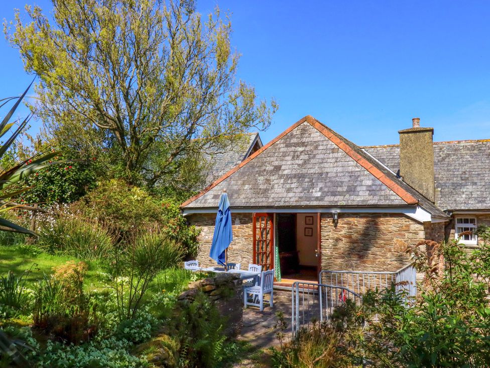 A garden view with a building and furniture at East Bickleigh Halwell