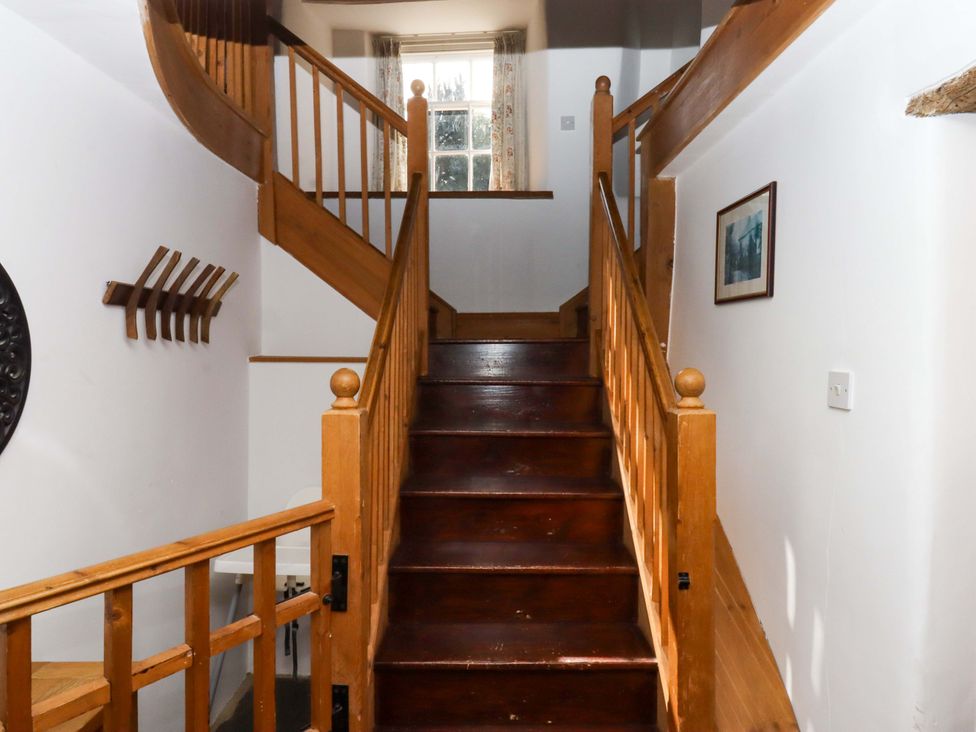 A staircase leading to an upper level at Oak Tree in Halwell