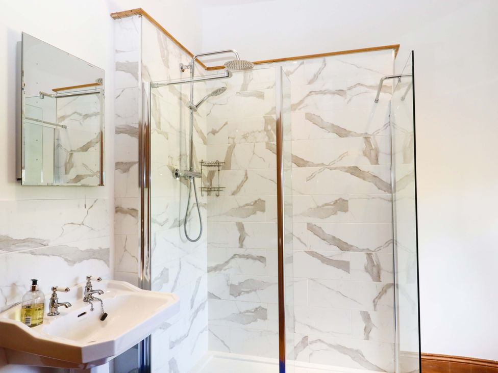 A bathroom with a shower and sink at Oak Tree in Halwell