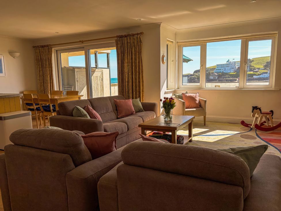 A living room with a sofa and table at 5 Burgh Island Causeway in Bigbury-on-Sea