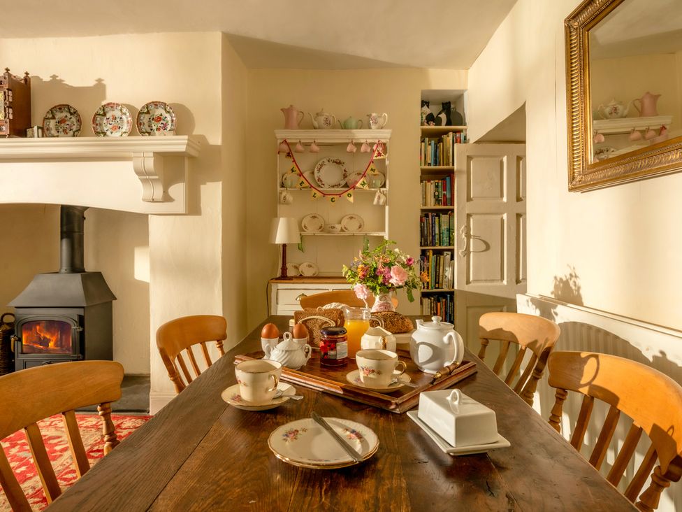 A dining room with a table set for tea at Parnacott in Holsworthy