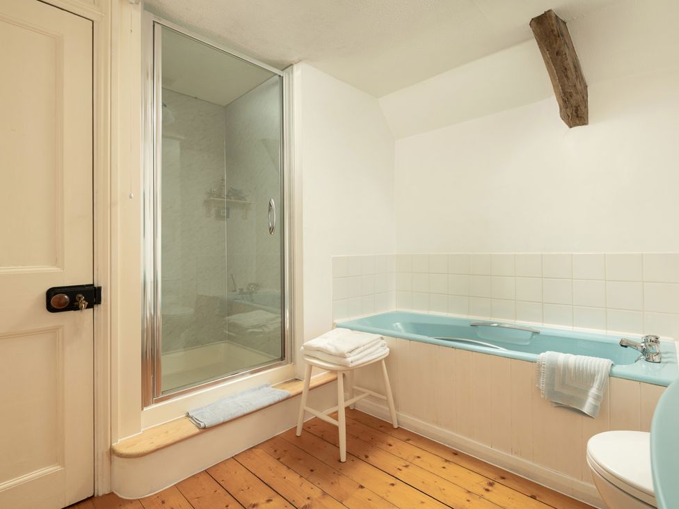 A bathroom with a shower and bathtub at Parnacott in Holsworthy