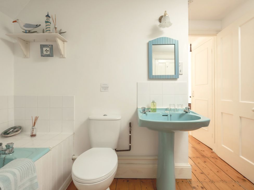 A bathroom with a sink and toilet at Parnacott in Holsworthy