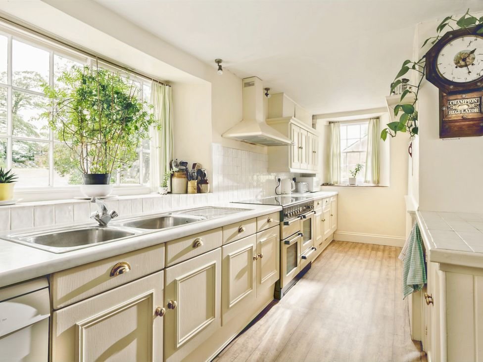 A kitchen with a sink and stove at Parnacott in Holsworthy