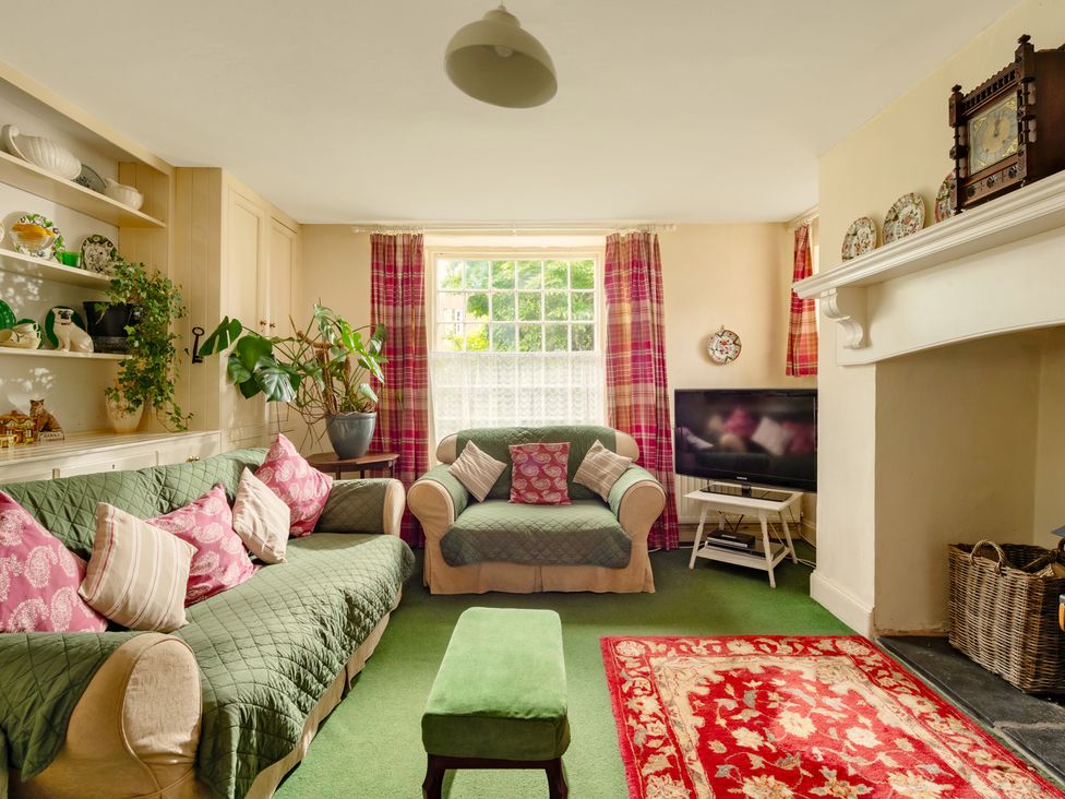 A living room with a sofa and television at Parnacott in Holsworthy