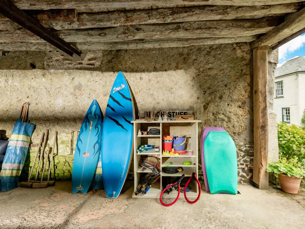 A storage area with surfboards and beach gear at Parnacott Holsworthy