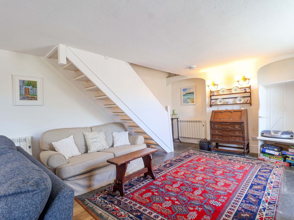 A living room with a sofa and coffee table at Agar Cottage in Trelights, near Port Isaac
