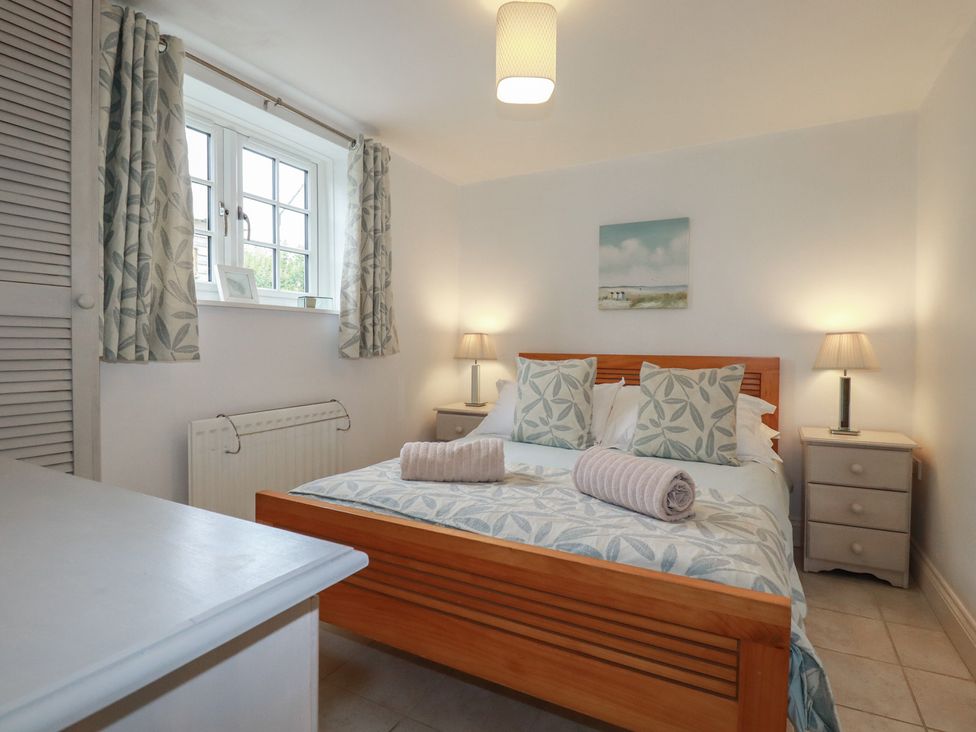 A bedroom with a bed and bedside tables at Atlantic View in Tintagel